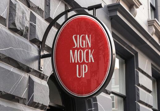 Round Hanging Shop Sign Mockup Template on Bracket at Stone Storefront, Circular Store Signage for Logo Branding and Business Identity Presentation, Realistic Street Scene