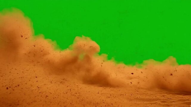Exploding sand cloud dirt burst motion effect on green screen chroma key background video footage