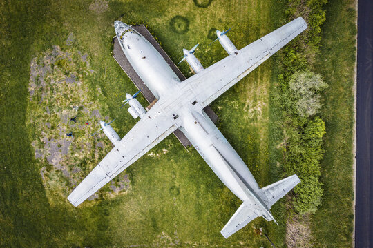 Aerial view of the Antonov 12 aircraft parked on a grassy field in Rummu, Laane County, Estonia.
