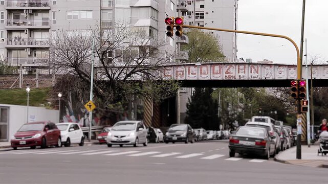 Daytime City Traffic and Vehicles Passing Under Train Bridge in Palermo Neighborhood, Buenos Aires, Argentina - 4K
