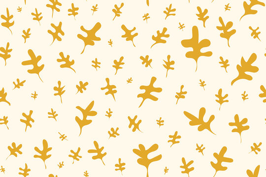 Seamless pattern of yellow oak leaf shapes on warm cream surface for autumn design