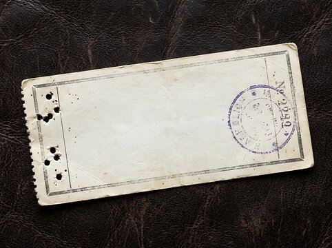 Blank vintage admission ticket stub with purple ink stamp on dark textured background blank space paper texture admission template collectible ephemera performance background historical