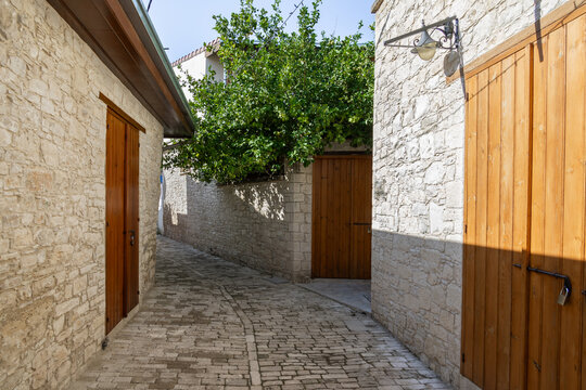 Cobblestone quiet the narrow Panagias Chalkidikis Street lined with old houses in mountain Omodos village in Cyprus
