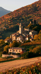 Fototapeta premium a picturesque village nestled amidst a hillside covered in autumn foliage. The village features a mix of traditional stone and stucco structures, including a church with a bell tower.
