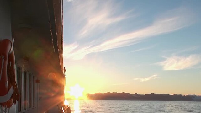 Arctic Ocean Ship Crossing Northern Ocean Waters Under Arctic Sky. Soft polar light and gentle surface reflections remain visible across the cold open water. Remote Arctic atmosphere remains clear.