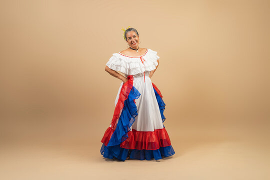 A Costa Rican woman posing in traditional pollera dress