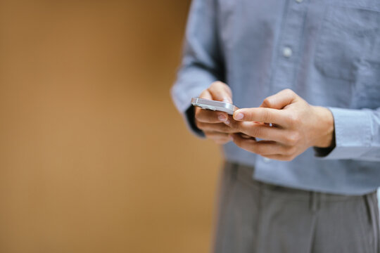 Person Using Smartphone Indoors in a Casual Setting