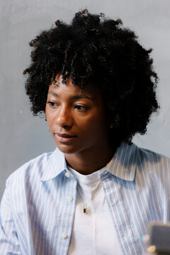 Close-up of a Black businesswoman during a meeting with investors.
