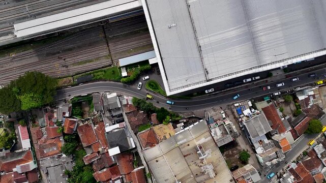 Aerial view of Stasiun Kereta Cepat Padalarang showing the modern station building, railway tracks, and surrounding residential area in Padalarang, West Java, Indonesia.