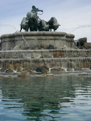 Copenhage, Denmark. August 13, 2026, Gefion Fountain sculpture in Copenhagen, Denmark, showing the goddess Gefion driving four bulls, with water flowing © tanaonte