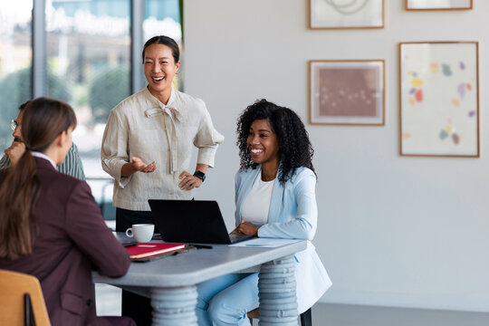 Colleagues Smiling During Business Meeting