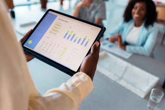 Business Presentation On Tablet During Team Meeting