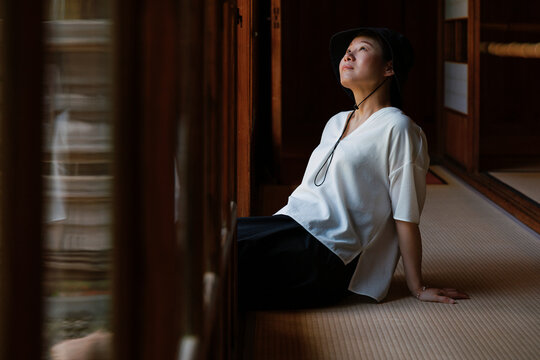 Intellectual Woman Enjoying Cozy Time Under the Eaves