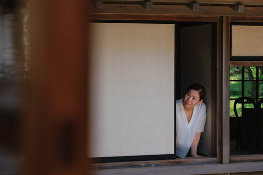 Slow Life Woman Enjoying Solitude by the Japanese Window