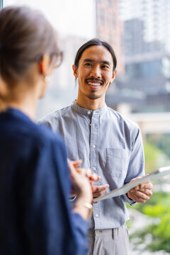 Meeting Between Two People in a Modern Office Setting