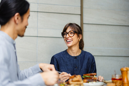 Couple Enjoys Meal Together in Cafe With Modern Decor