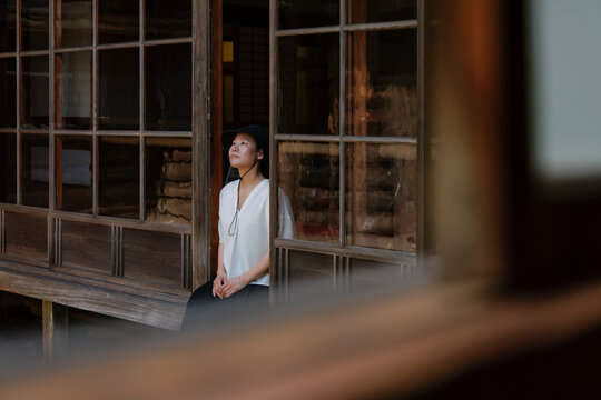 Summer Rest Under the Eaves: A Woman Enjoying Slow Life