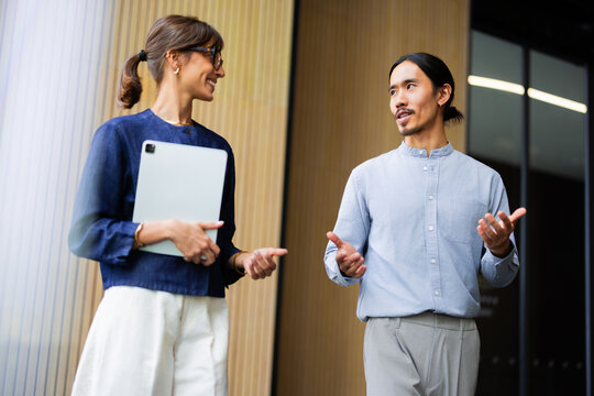 Business Meeting Between Two Coworkers in a Modern Office