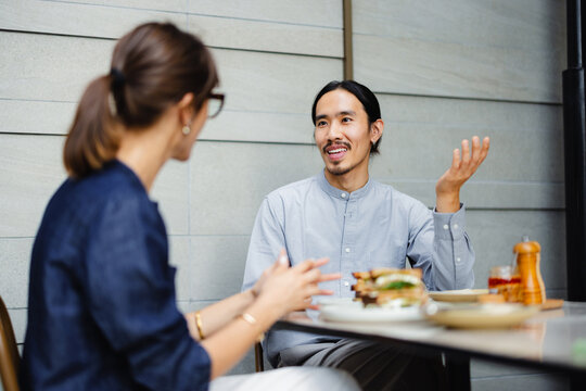 Conversation Between Two People in a Modern Cafe Setting