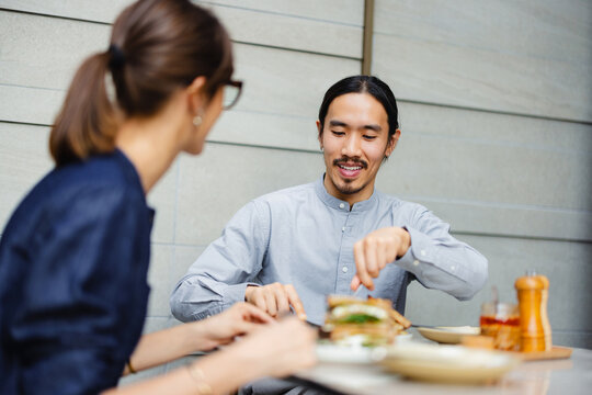 Eating Lunch at a Restaurant With Friends in a Casual Setting