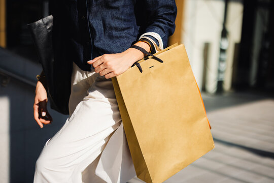 Woman Walking With Shopping Bag in a City Environment