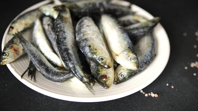Sardines fish fresh small seafood pescatarian diet serving size fish&nbsp;natural ingredients healthy eating, wholesome dish, tasty snack fresh, gourmet, rustic food background on the table top view copy s