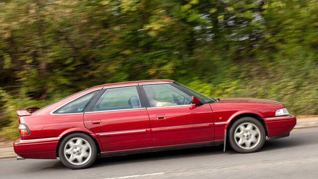Milton Keynes; UK - Sept. 27th 2026:  1999 red Rover 825 diesel engine  classic car driving on a British road