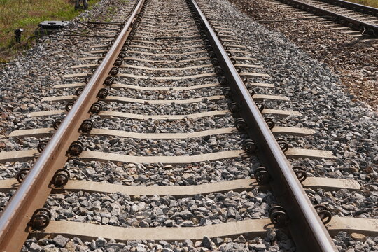 Parallel Railroad Tracks Stretching Into the Distance Symbolizing Journey Future Path and Transportation Infrastructure with Shallow Depth of Field