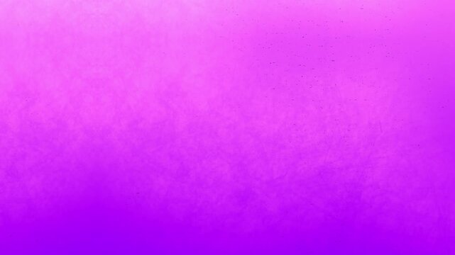 Animation of black paint splodges on pink background