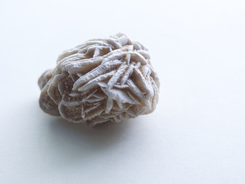 Sand rose crystal on white