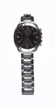 Vintage wristwatch with a strap, isolated on a white background.