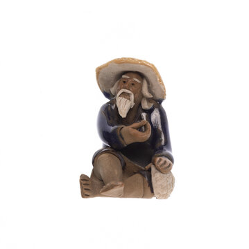 Porcelain figurine of an old Chinese man, isolated on a white background.