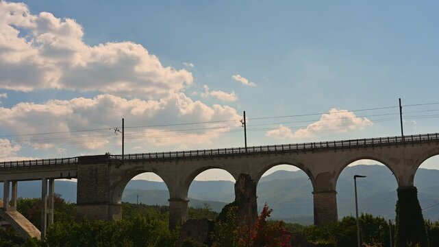 Destroyed in the Allied bombings of 1943, it was rebuilt in its current form. It is supported by two sets of arches separated by a large arch spanning the Carpino River.