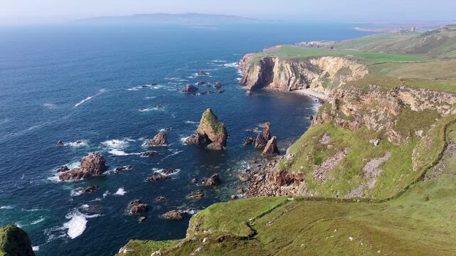 Aerial view of Crohy Head with its rugged sea stacks and dramatic cliffs overlooking the Atlantic Ocean in Maghery, County Donegal, Ireland.