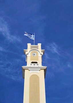 Low-angle view of the historic Clock Tower of Xanthi, an Ottoman-era landmark rising prominently in the central square (Dimokratias square) of Xanthi, northern Greece, in the region of Western Thrace.