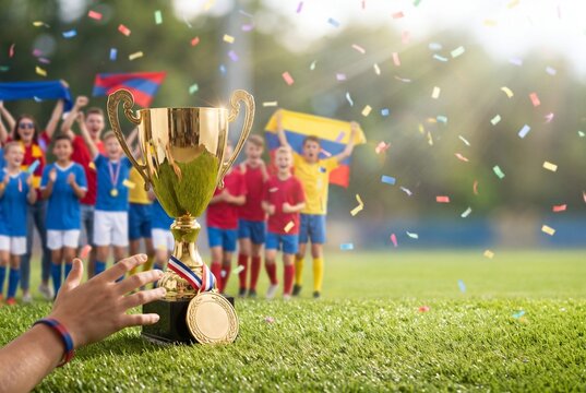 Youth soccer team celebrates victory with trophy