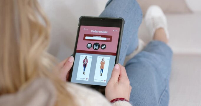 Shopper is reviewing thumbnails and tapping left product card on tablet to view details