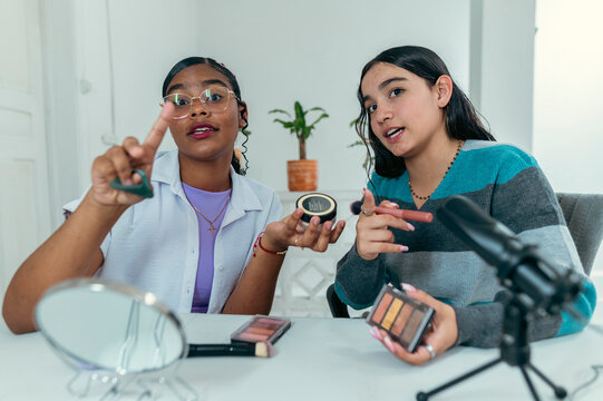 Young latin women creating online makeup tutorial content