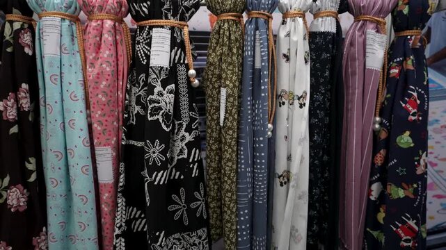 Floral and Geometric Print Fabric Samples in Row, Colorful Patterned Textile Swatches on Display