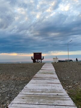 Road to the sea and life guard tower.