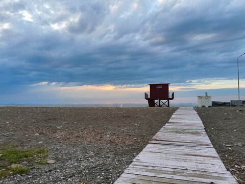 Road to the sea and life guard tower.