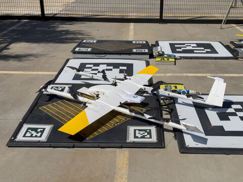 delivery drones resting and charging on pads