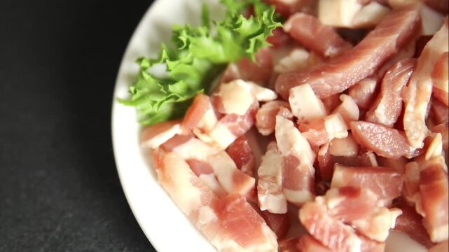 Bacon sliced into pieces pork meat lard serving size natural ingredients eating dish, tasty snack fresh, gourmet, rustic food background on the table top view copy space