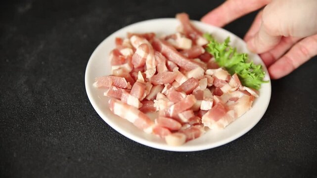Bacon sliced into pieces pork meat lard serving size natural ingredients eating dish, tasty snack fresh, gourmet, rustic food background on the table top view copy space