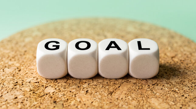 Four White Dice Spell the Word GOAL