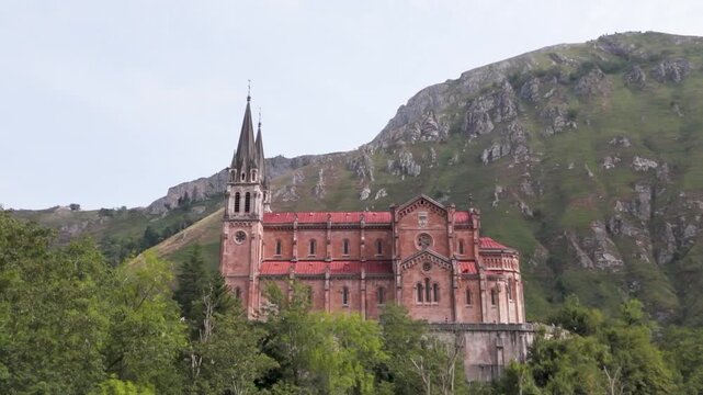 Historic Basilica of Covadonga Surrounded by Green Mountains in Asturias, Spain