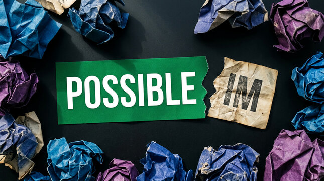 Crumpled paper with "POSSIBLE" and "IM" fragments, symbolizing the transformation from impossible to possible, representing challenge and achievement