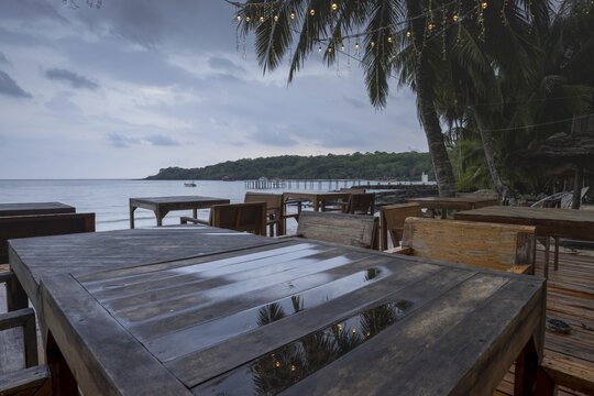 Rainy terrace of a restaurant early in the morning, Siam Beach in front of sunrise, Ko Kut or Koh Kood, Gulf of Thailand, Thailand
