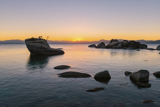 Bonsai Rock, small tree on a rock in the water, sunset, Lake Tahoe, California, USA