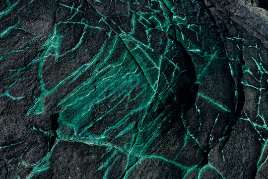 Detail of a volcanic rock with malachite veins, Horseshoe Island, Marguerite Bay, Antarctica,